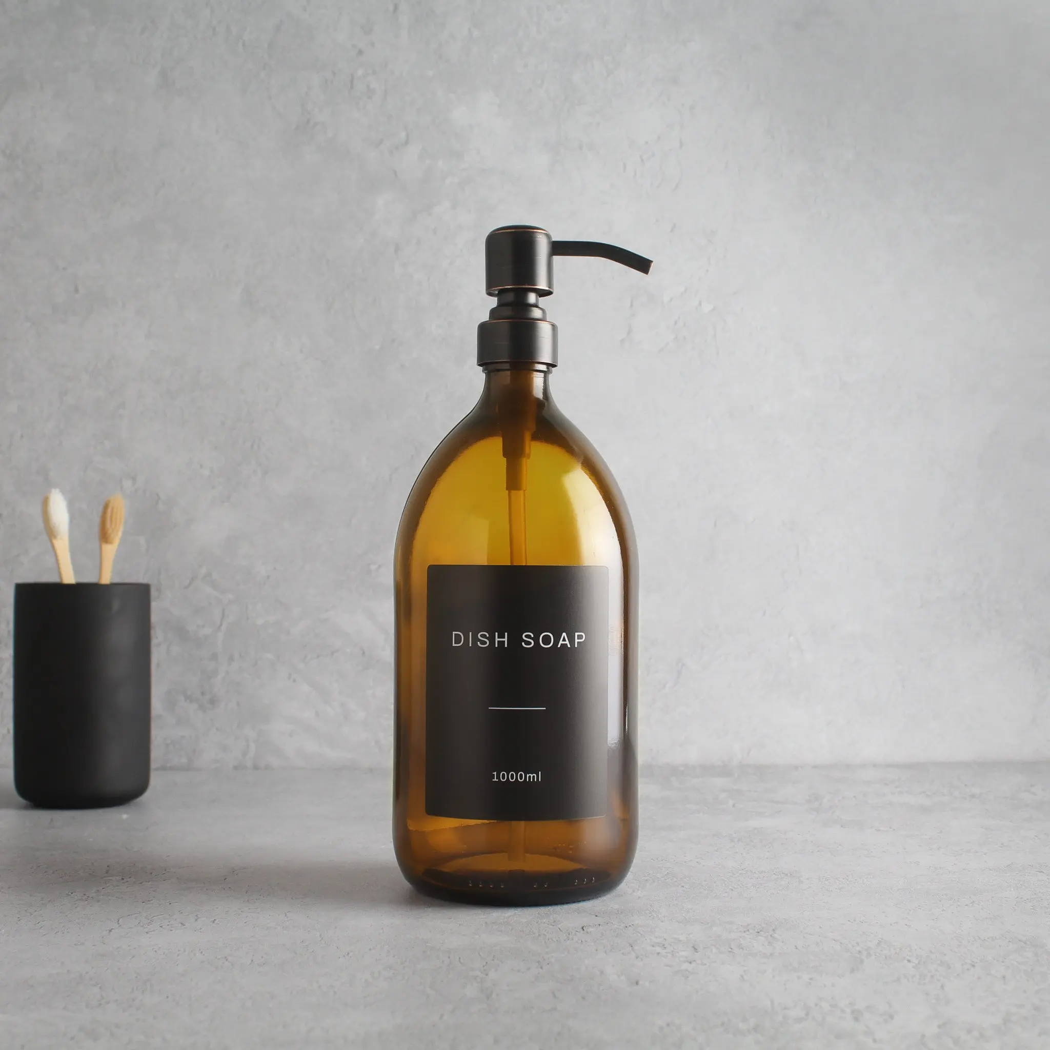 Labelled Amber Glass Dispenser Bottle With Black/Copper Pump - Image 3
