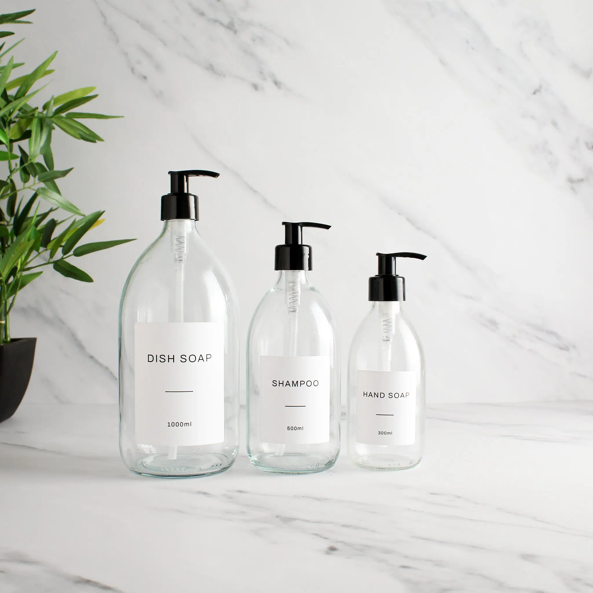 Labelled Clear Glass Dispenser Bottle With Black Pump - Image 2