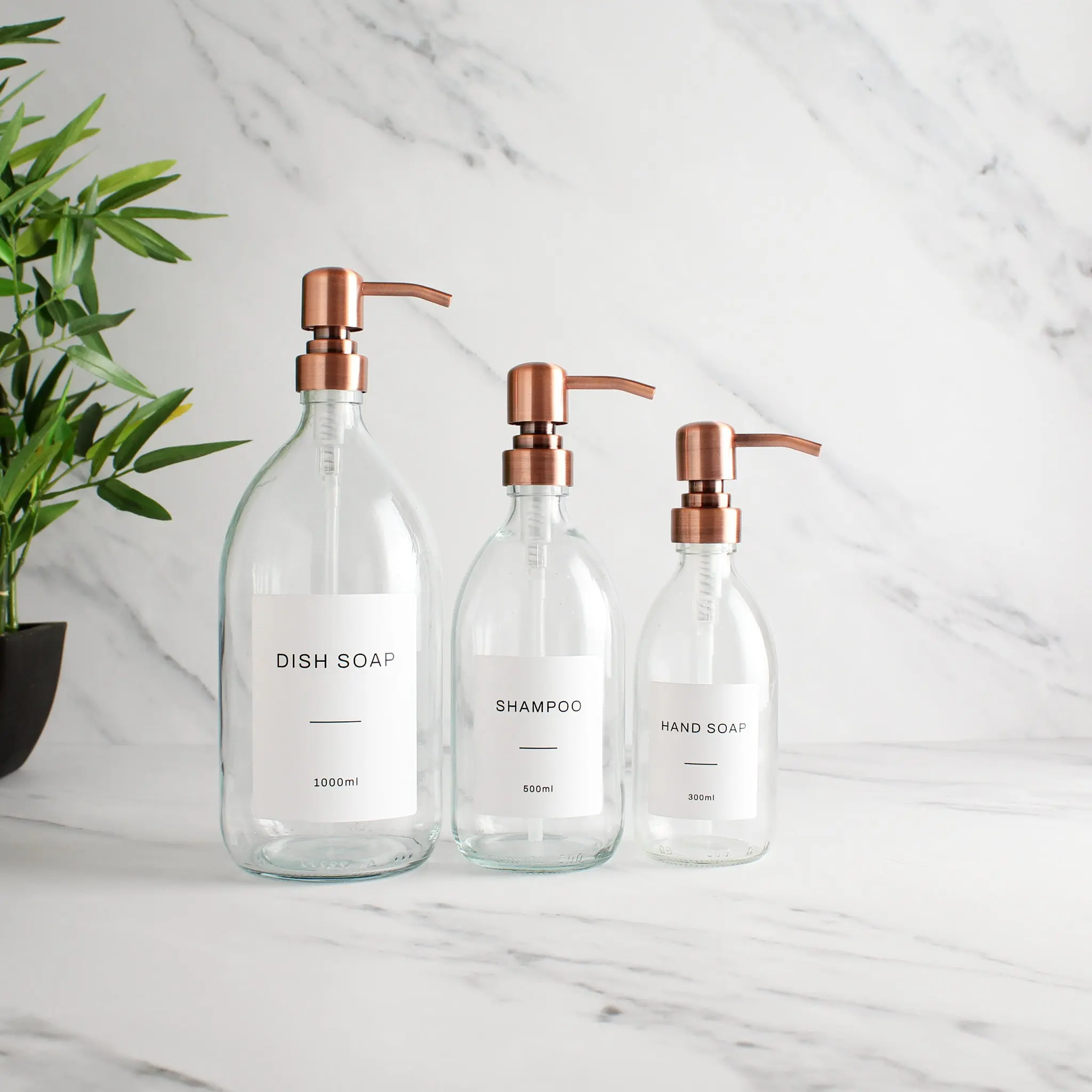Labelled Clear Glass Dispenser Bottle With Rose Gold Pump - Image 2