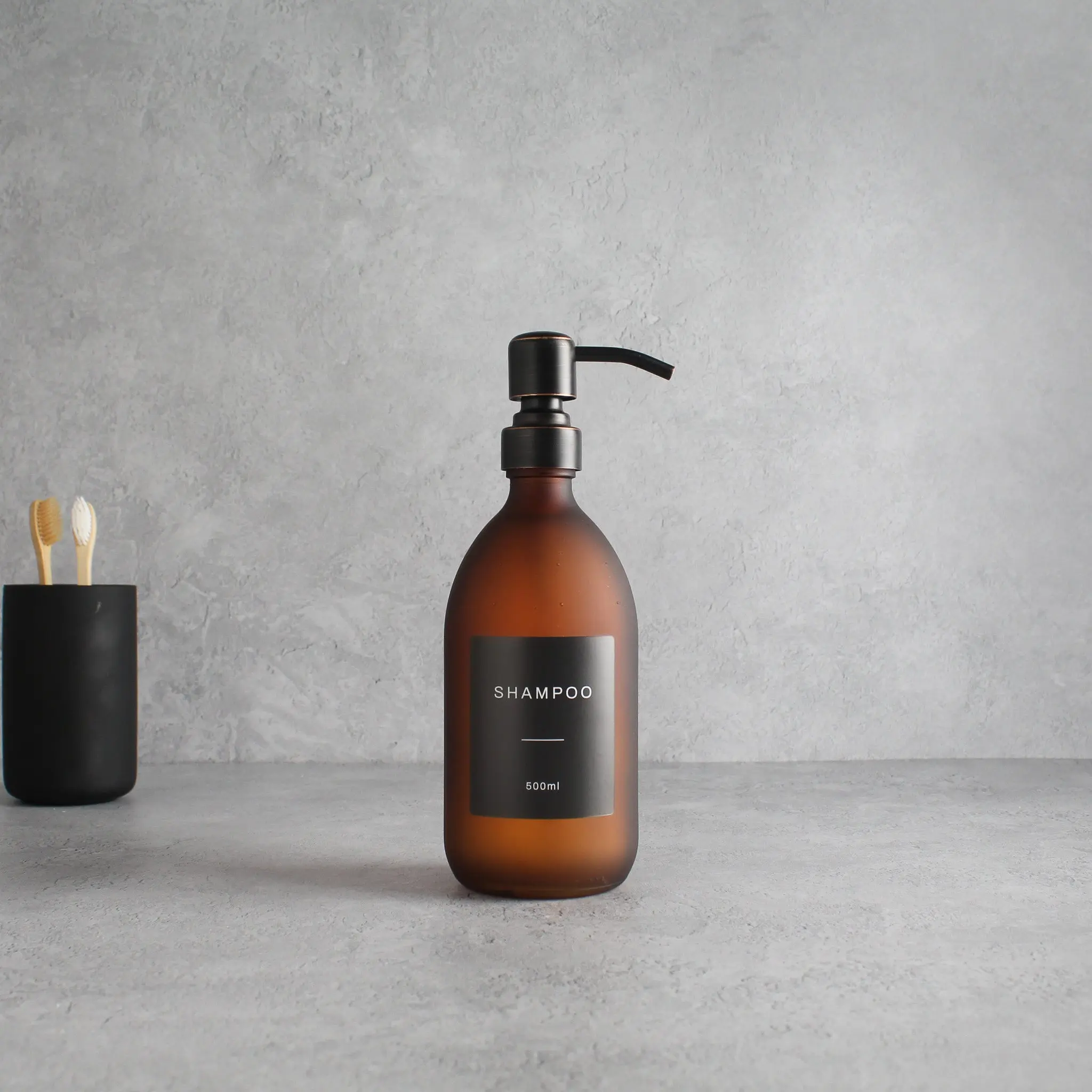 Labelled Frosted Amber Glass Dispenser Bottle With Black/Copper Pump - Image 4