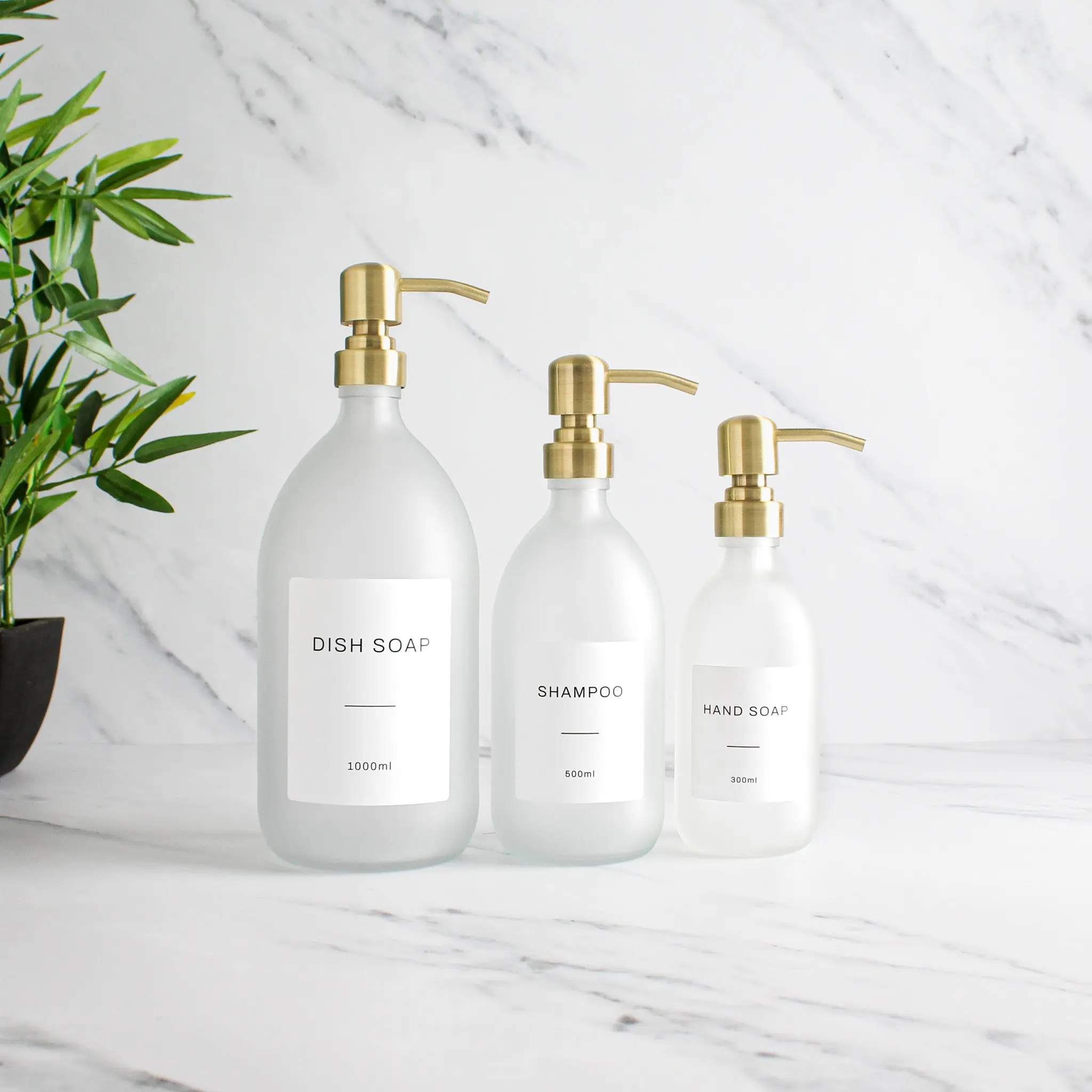 Labelled Frosted White Glass Dispenser Bottle With Gold Pump - Image 2
